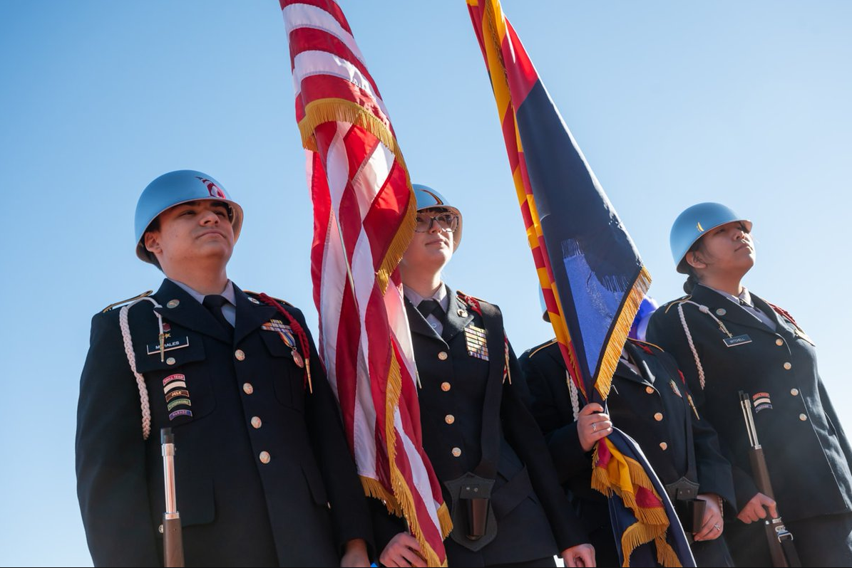 JROTC standing at attention with the US Flag and Arizona Flag